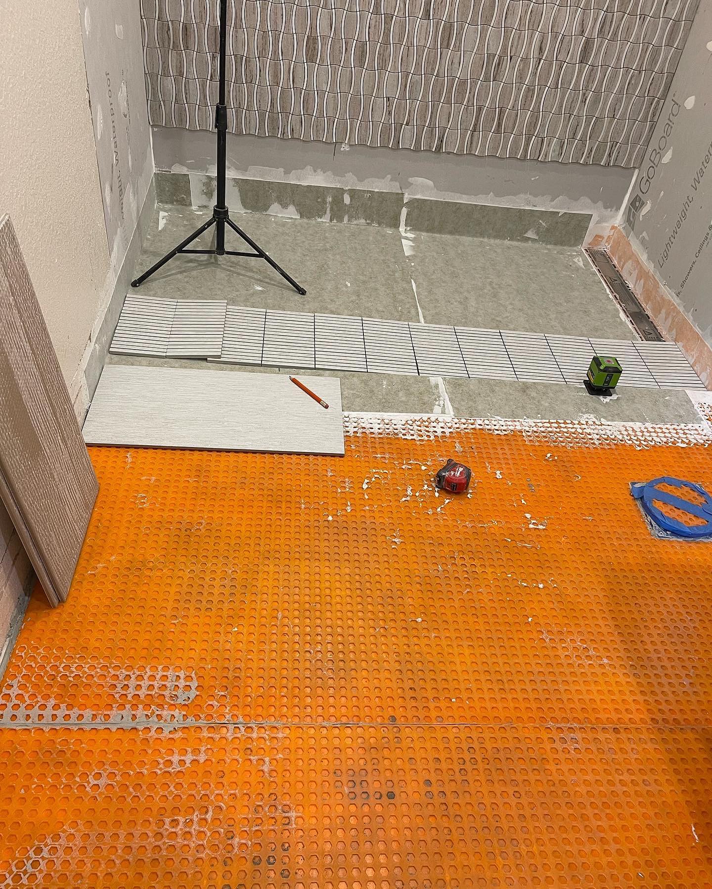 Prep, waterproofing, and layout during shower installation